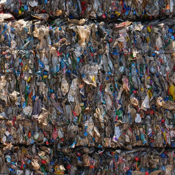 Bales of mixed plastic waste at a recycling centre