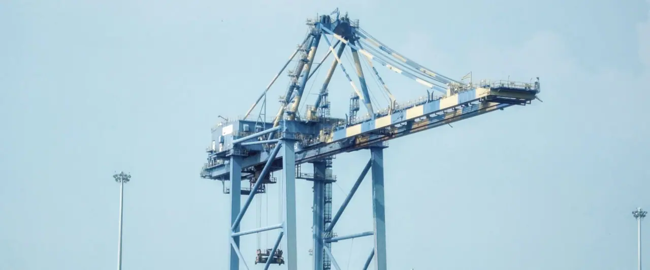 Container ship and cranes at an industrial port